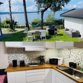 Nice Apartment with1 bedroom Separate living room with a sofa bed and a tiny kitchen a bathroom located in Nordstrand near by the Sea for 3 guests with a garden and grill 5 extra guests with extra cos